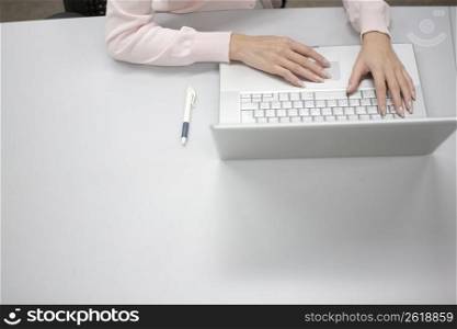 Hands operating a PC