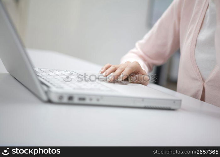 Hands operating a PC