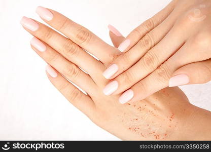 Hands put cosmetic means one on another, isolated