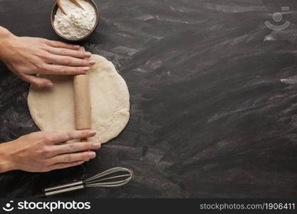 hands rolling bread dough with whisk. High resolution photo. hands rolling bread dough with whisk. High quality photo