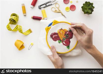 hands sewing cute fruit design white background. High resolution photo. hands sewing cute fruit design white background. High quality photo