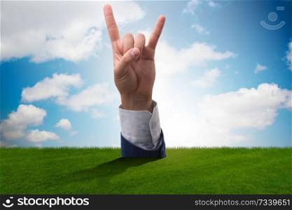 Hands showing victory sign in business concept