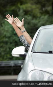 Hands sticking out of car