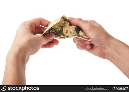 Hands tear money