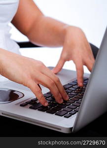 Hands typing on laptop Indoor studio