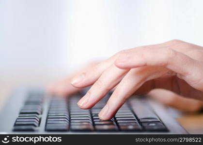 Hands typing on the keyboard