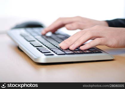 Hands typing on the keyboard