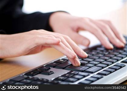 Hands typing on the keyboard