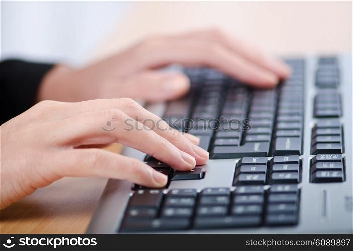 Hands typing on the keyboard