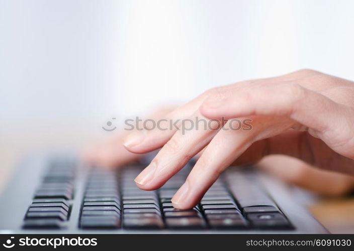 Hands typing on the keyboard