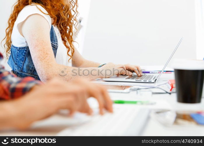 Hands typing on the keyboard. Hands of office worker typing on the keyboard