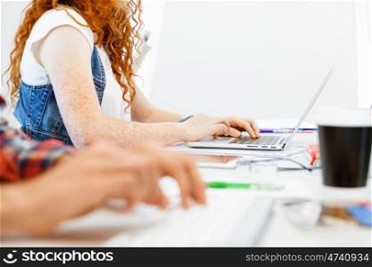 Hands typing on the keyboard. Hands of office worker typing on the keyboard