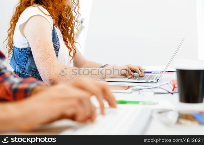 Hands typing on the keyboard. Hands of office worker typing on the keyboard