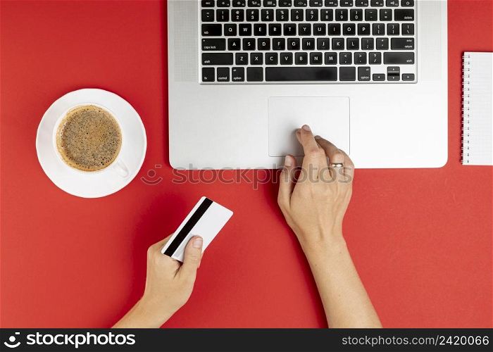 hands using computer holding card