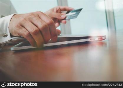 "hands using laptop and holding credit card with "Secure payment" on the screen as Online shopping concept"