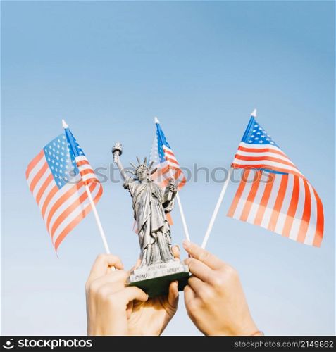 hands waving american flags