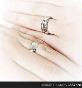 Hands wearing wedding rings