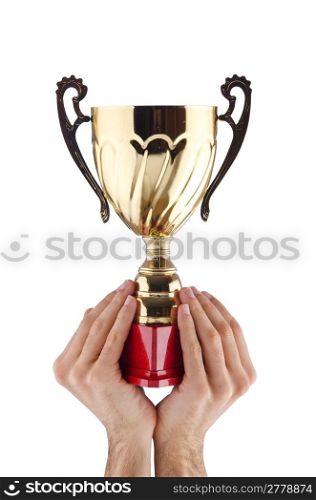 Hands with winners cup on white