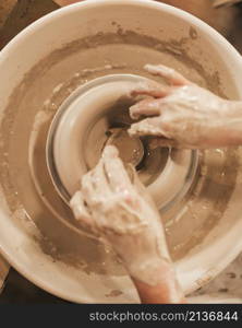 hands woman process making clay bowl pottery wheel