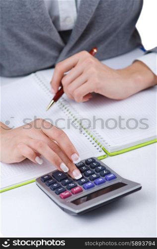 Hands working on the calculator