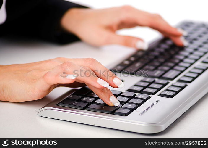 Hands working on the keyboard