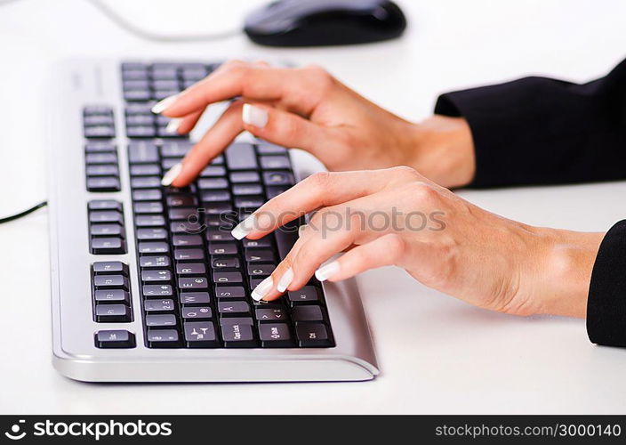 Hands working on the keyboard