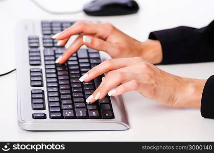 Hands working on the keyboard