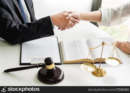 Handshake after cooperation between attorneys lawyer and clients discussing a contract agreement hope of victory over legal fighters, Concepts of law, advice