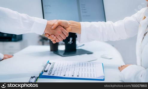 Handshake After Signing Health Insurance Form