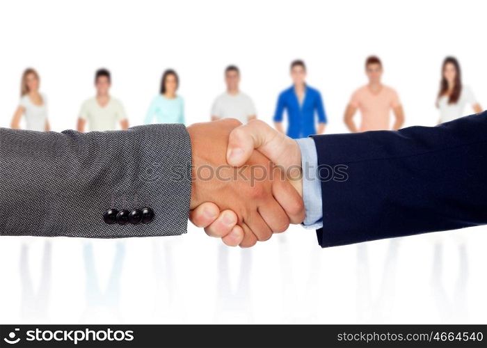 Handshake between businessmen with unfocused people of background&#xA;