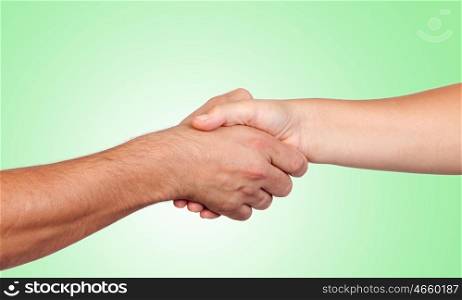 Handshake between two hands isolated on green background