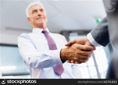 Handshake of businessmen greeting each other. Handshake of businessmenoncepts - soft focus