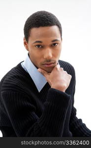 Handsome African American male in blue shirt and black sweater, isolated