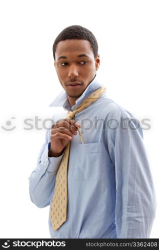 Handsome African American male in blue shirt and yellow tie putting pen in pocket, isolated