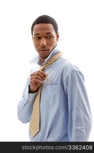 Handsome African American male in blue shirt and yellow tie putting pen in pocket, isolated