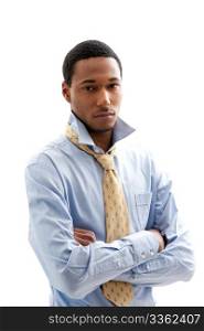 Handsome African American male in blue shirt and yellow tie with arms crossed and collar up, isolated
