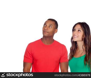 Handsome african guy and his caucasian girl looking up isolated on a white background