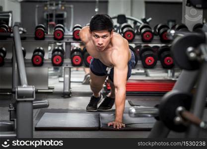 Handsome Attractive Asian men workout push up in gym to focus on muscle feeling so strong and motivation for build body,Bodybuilder concept