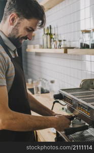 handsome bartender making coffee