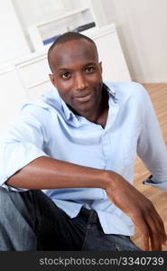 Handsome black man relaxing at home