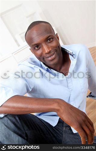 Handsome black man relaxing at home