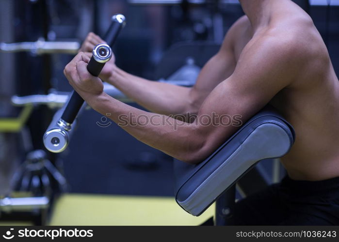 Handsome bodybuilder guy prepare to do exercises on gym