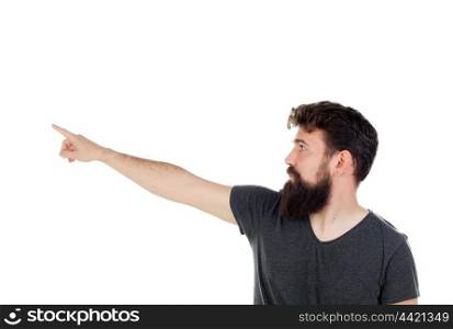 Handsome boy indicating something with his finger isolated on a white background