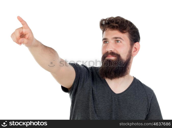 Handsome boy indicating something with his finger isolated on a white background