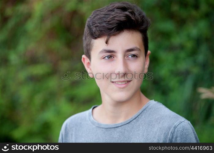Handsome brown-haired teen in the park