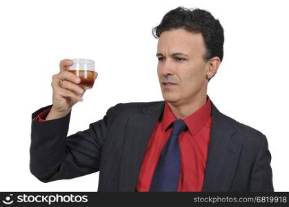 Handsome business man holding an alcoholic drink