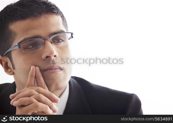 Handsome business man lost in thought