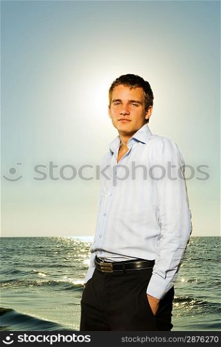 Handsome business man near the ocean