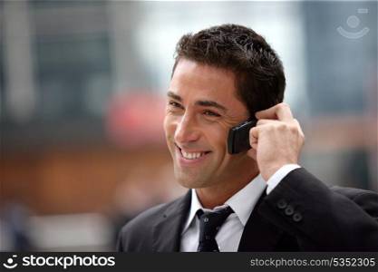 handsome businessman having phone call