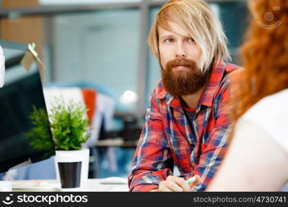 Handsome businessman in office. Handsome businessman in casual wear working in office